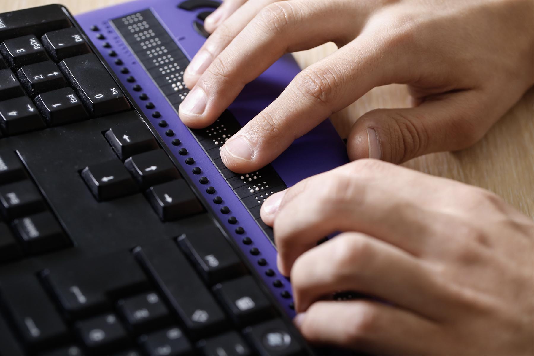 ADA compliance includes websites that can be accessed using devices for the visually impaired, like this braille reader.