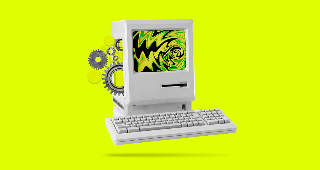 An old computer in front of a green background with gears coming out of the side and a wavy pattern on the screen.