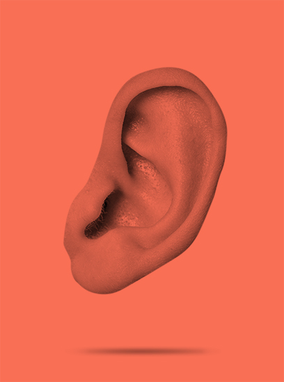 An ear in front of a red background.