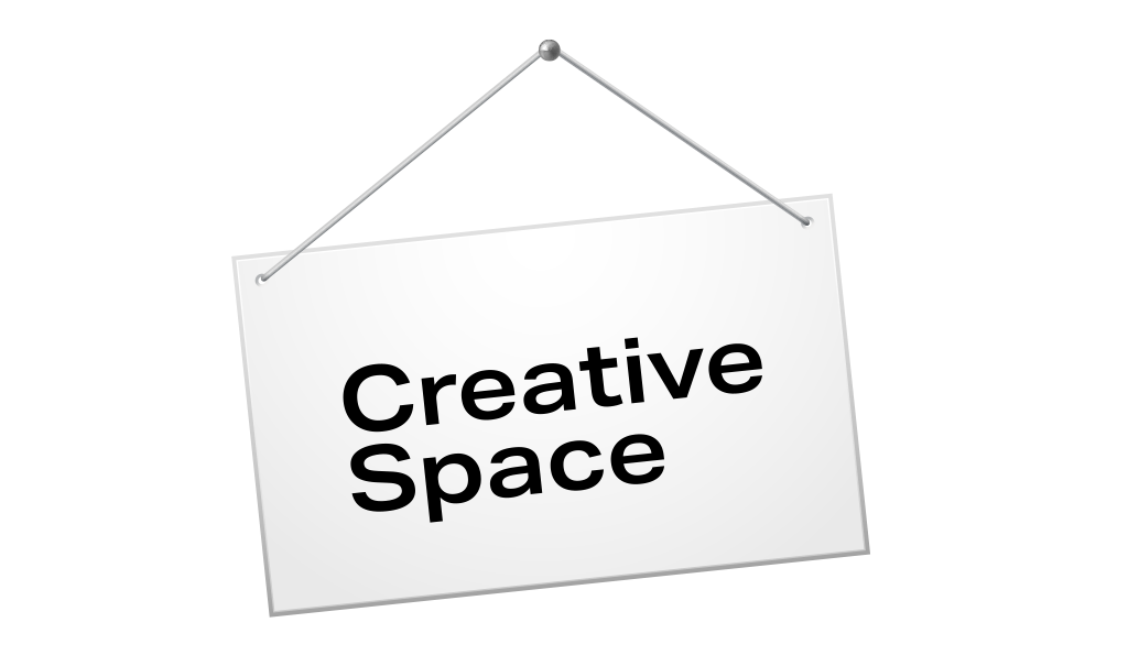 A hanging sign that reads, "Creative Space."