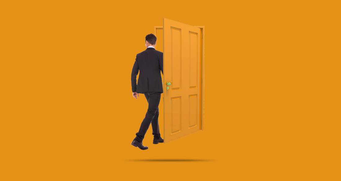 A man walking through a floating, orange door, on an orange background.