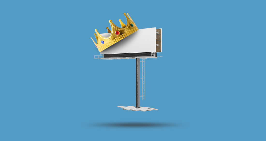 Billboard with a crown on it floating against a blue background